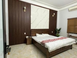 Ένα ή περισσότερα κρεβάτια σε δωμάτιο στο Ỉn Homestay & Café