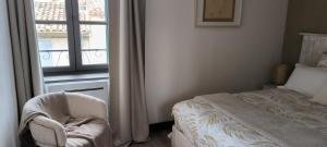 Łóżko lub łóżka w pokoju w obiekcie Appartement sous les remparts