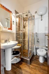 a bathroom with a shower and a sink and a toilet at Al Ponte Del Papa B&B in Rome +59 photos