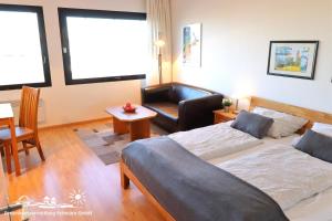 Postel nebo postele na pokoji v ubytování 34 Ferienwohnung App.58-410