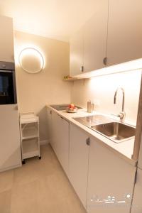 Η κουζίνα ή μικρή κουζίνα στο 32 Ferienwohnung Baltic Nest App.65-103 +8 φωτογραφίες