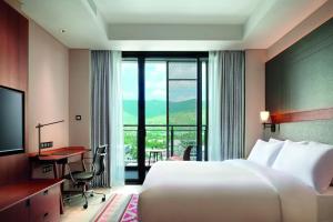 TV a/nebo společenská místnost v ubytování Palm Springs Hotel Dili
