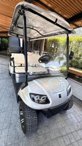 a golf cart parked in front of a building at The Silver Palm Wellness Resort in Bangkok