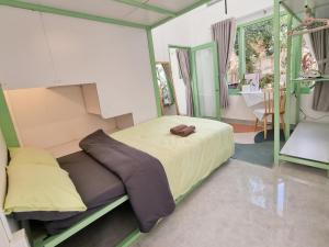 Postel nebo postele na pokoji v ubytování Anh Quân House