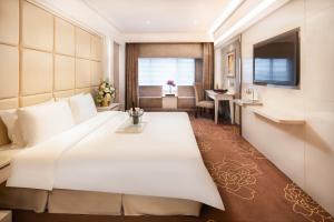 Voodi või voodid majutusasutuse Rio Hotel toas