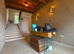 a room with a desk with a computer on a table at Tranquil Getaway with Shared Pool in Bale in Bale