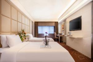 Voodi või voodid majutusasutuse Rio Hotel toas