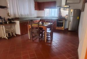 Kuchyň nebo kuchyňský kout v ubytování Casa y Restaurante- Pizzeria La Pergola