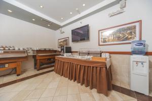 TV a/nebo společenská místnost v ubytování Hotel Stella di Mare