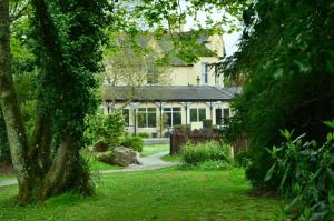 a house with a garden in front of it at 14 Tudor Court, Tolroy Manor in Hayle