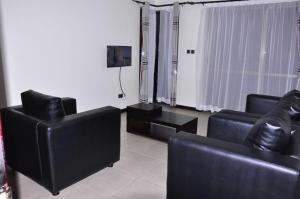 TV a/nebo společenská místnost v ubytování Denver Elysium Apartments and Residences + 7 fotografií