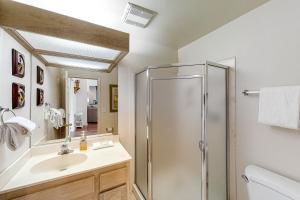 a bathroom with a shower and a sink at Forest Falls in Shaver Lake +24 photos