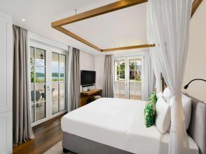 Postel nebo postele na pokoji v ubytování Mövenpick Balaland Resort Lake Balaton