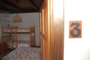 Łóżko lub łóżka w pokoju w obiekcie Casa rural Dalia