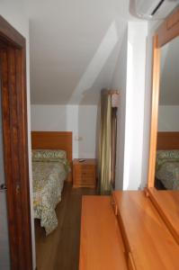 Łóżko lub łóżka w pokoju w obiekcie Casa rural Dalia