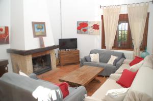 Telewizja i/lub zestaw kina domowego w obiekcie Casa rural Dalia