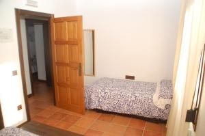Łóżko lub łóżka w pokoju w obiekcie Casa rural Dalia