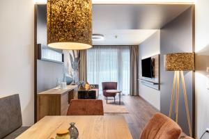 Televízia a/alebo spoločenská miestnosť v ubytovaní Hotel zum Schwanen - Appartement 1