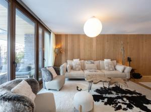 a living room with a couch and a table at Isard Homes by Select Rentals in El Tarter +37 photos