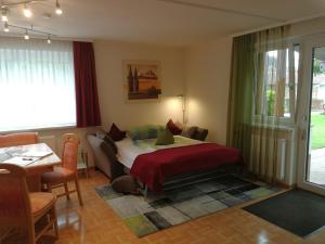 A bed or beds in a room at Ferienwohnungen Oranhof