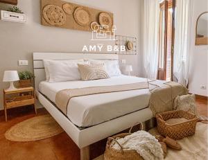 Postel nebo postele na pokoji v ubytování Amy B&B casetta di charme