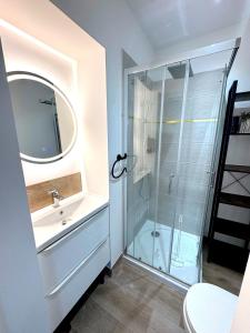 a bathroom with a shower and a sink at Résidence La Ruelle Secrete - 5 studios - in Ruelle-sur-Touvre +80 photos