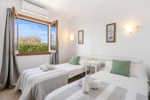 A bed or beds in a room at Villa Bini Chic