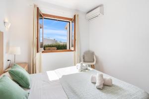 A bed or beds in a room at Villa Bini Chic