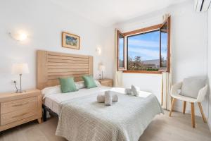 A bed or beds in a room at Villa Bini Chic