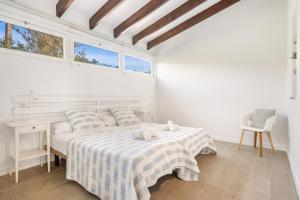 A bed or beds in a room at Villa Bini Chic Még 35 kép