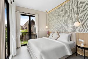 Ένα ή περισσότερα κρεβάτια σε δωμάτιο στο Marea Villa by Kozystay - Jimbaran