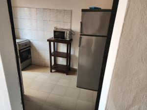 Kuchyň nebo kuchyňský kout v ubytování Appartements meublés 26 mars