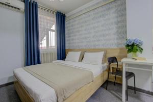 Postel nebo postele na pokoji v ubytování Viva Hotel