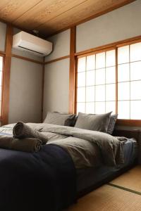 Postel nebo postele na pokoji v ubytování Tob-inn Myoko + 25 fotografií