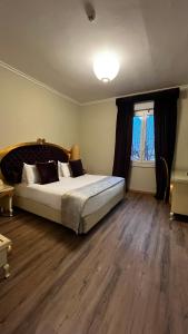 A bed or beds in a room at Zanhotel Tre Vecchi