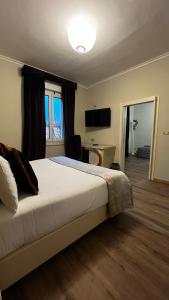 A bed or beds in a room at Zanhotel Tre Vecchi