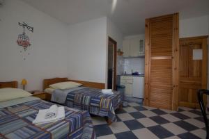 Ένα ή περισσότερα κρεβάτια σε δωμάτιο στο Apartments Blue
