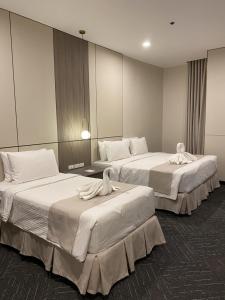 Postel nebo postele na pokoji v ubytování ILOILO GRAND HOTEL