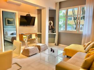a living room with a couch and a table at Leblon Dream Apartment in Rio de Janeiro