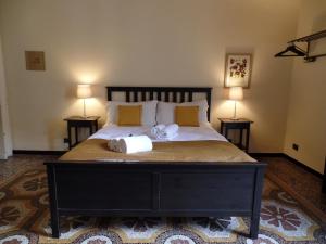 Postel nebo postele na pokoji v ubytování B&B Genova Centro