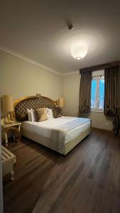 A bed or beds in a room at Zanhotel Tre Vecchi
