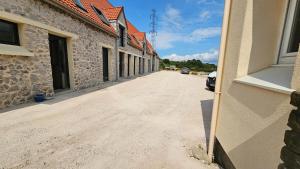 an empty street next to a building at Domaine Caloin - SPA in Echinghen