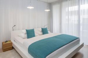 Postel nebo postele na pokoji v ubytování Apartments Spa Resort Styria- ADULTS ONLY