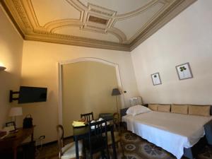 Postel nebo postele na pokoji v ubytování B&B Genova Centro