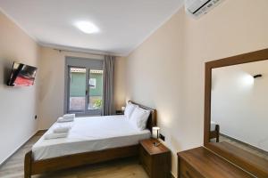 En eller flere senge i et værelse på Cosy Halipoma-Tilemahos into Lefkada town close