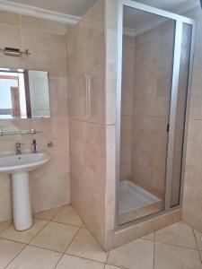 a bathroom with a shower and a sink at Casa olivos villa 100m de la plage in Al Hoceïma +9 photos
