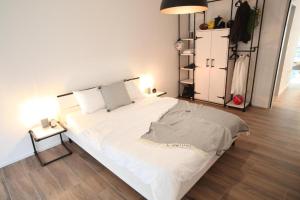 Postel nebo postele na pokoji v ubytování The City Zug Apartments + 17 fotografií
