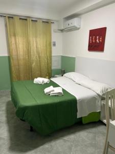 Postel nebo postele na pokoji v ubytování Hotel Alloggio Del Conte
