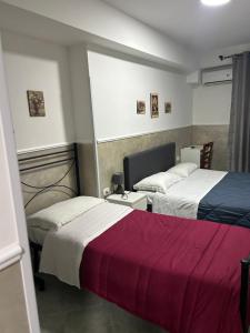 Postel nebo postele na pokoji v ubytování Hotel Alloggio Del Conte