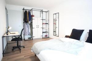 Postel nebo postele na pokoji v ubytování The City Zug Apartments